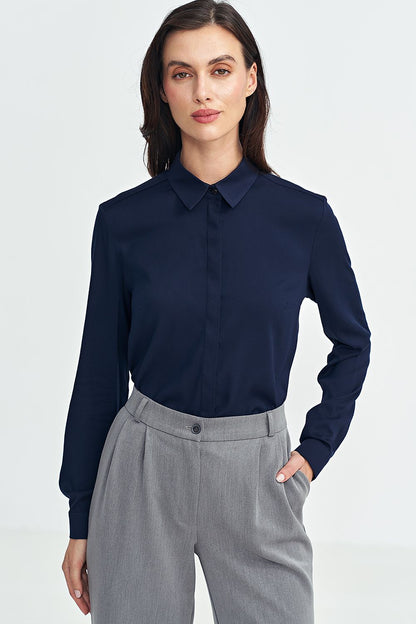 Fashionable women’s long sleeve shirt by Nife in various sizes, capturing the essence of luxury fashion with its sophisticated design and plush fabric.