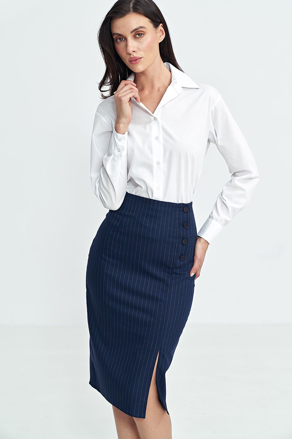 Elegant high-waisted skirt by Nife with slit and decorative button closure, exemplifying luxury fashion for sizes EU 36-42.