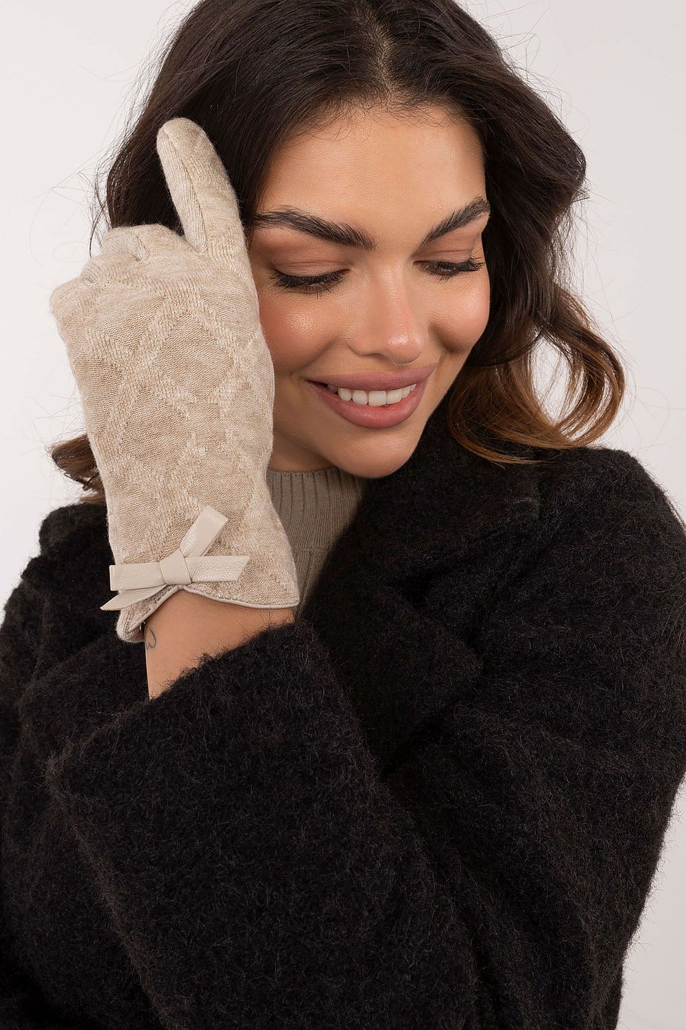 Close-up view of AT's women's gloves showcasing embroidered flower design on the index finger for smartphone use, embodying elegance and sophistication.
