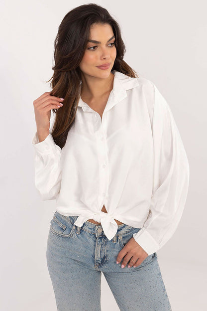 Close-up of the delicate embroidered flower detail on an Italy Moda long sleeve shirt, highlighting its luxurious fabric blend of polyester and elastane.