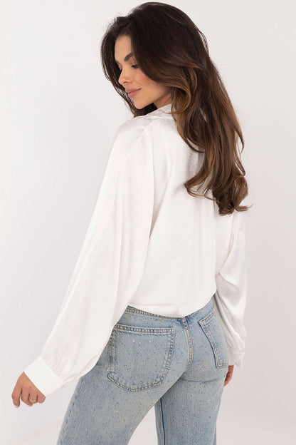 Model wearing Italy Moda's embroidered floral long sleeve shirt, demonstrating its versatile style suitable for both everyday wear and special events.