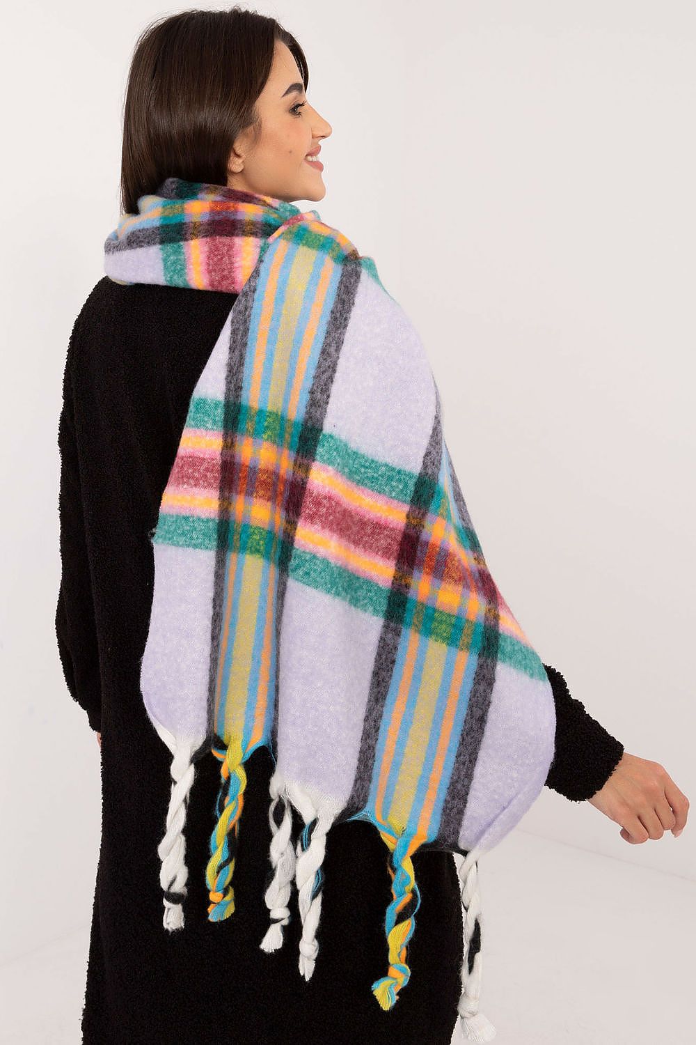 Versatile and fashionable winter scarf with a check pattern and tassels, designed by AT for elegance and warmth.