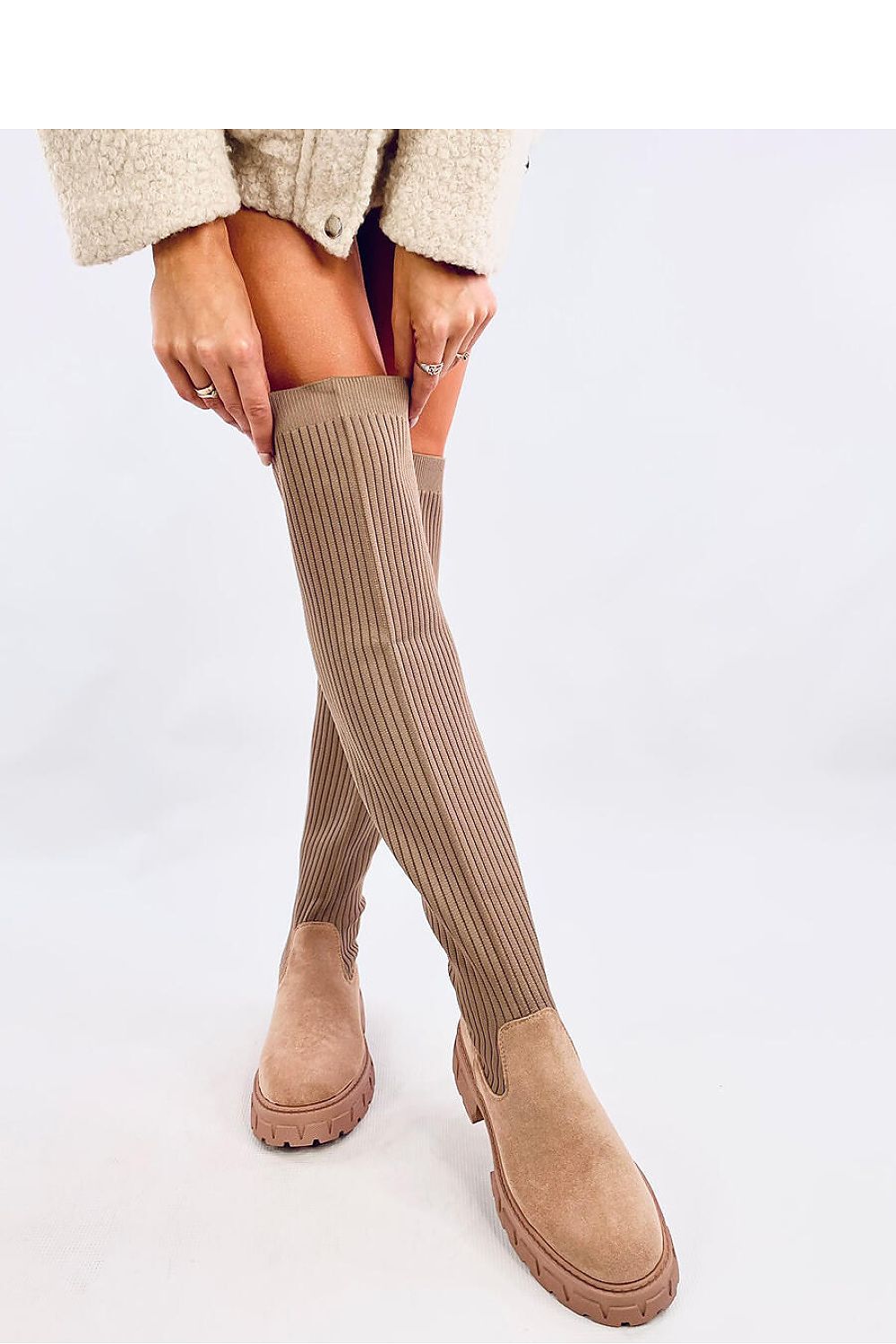 Stylish Inello women's jackboots with a sleek elastic upper and plush fur interior, designed for a comfortable fit and fashionable look.