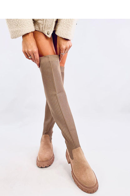 Stylish Inello women's jackboots with a sleek elastic upper and plush fur interior, designed for a comfortable fit and fashionable look.