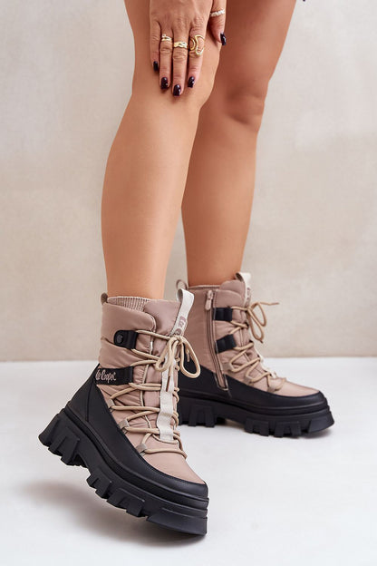 Luxury women's Lee Cooper snow boots in black, featuring a weather-resistant design, zip closure, and plush warm lining, ideal for winter elegance and comfort by Step in Style.
