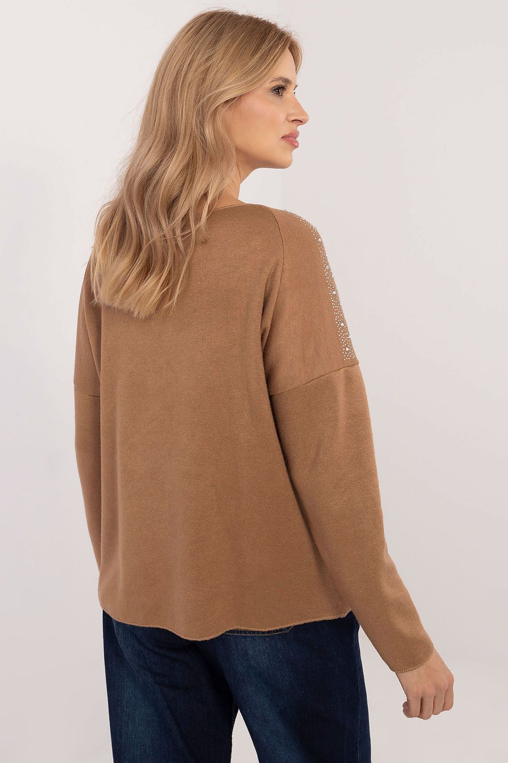 Chic women's sweater by Italy Moda displayed in a flattering pose, featuring a classic round neckline and comfortable long sleeves.
