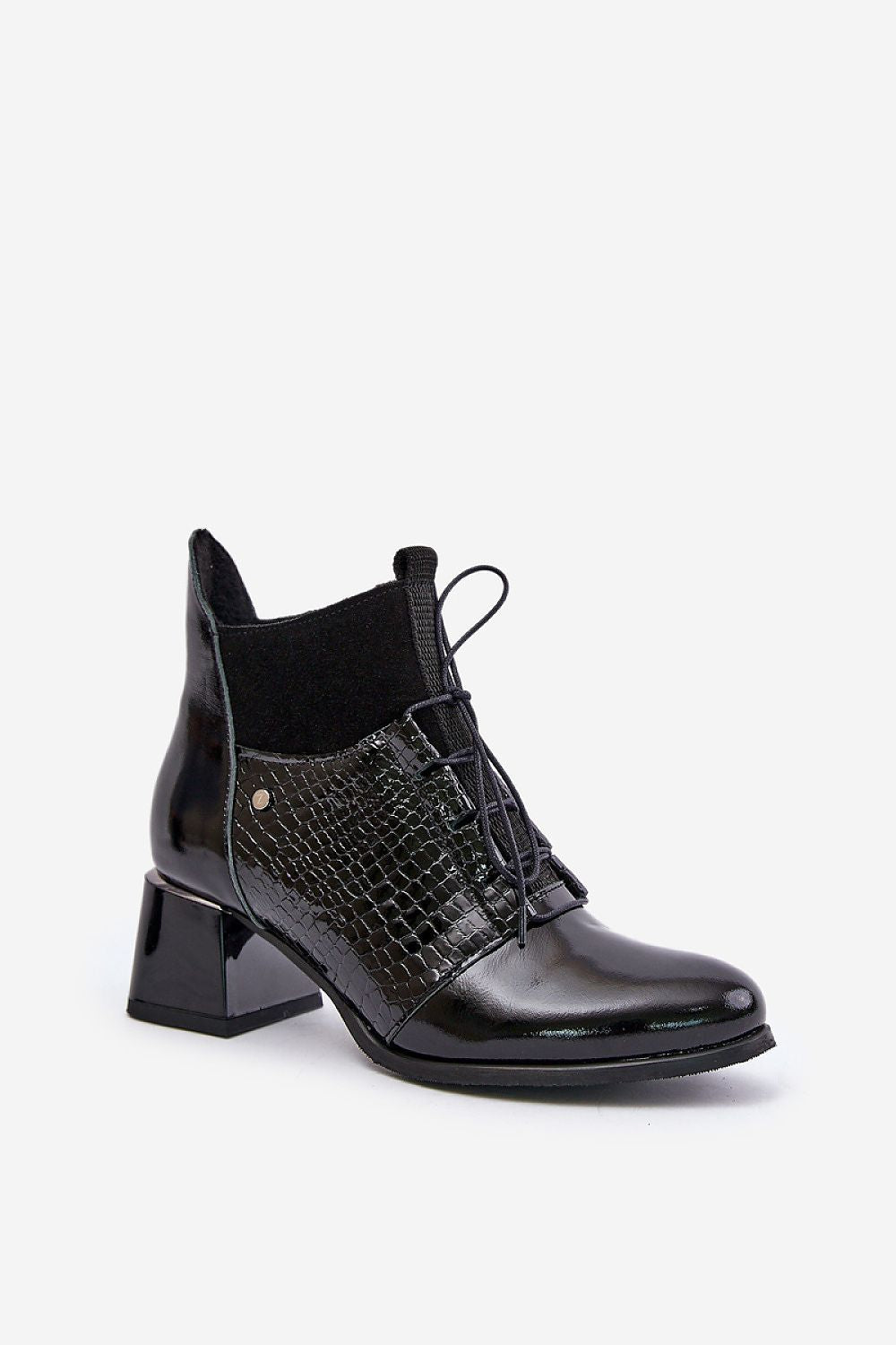 Chic and stylish leather ankle boots showcasing an eye-catching animal print, designed by Step in Style for a sophisticated winter wardrobe.