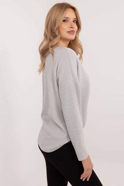 Model wearing Italy Moda's stylish women's V-neck sweater, featuring a flattering silhouette and elegant design, ideal for both casual and formal occasions.