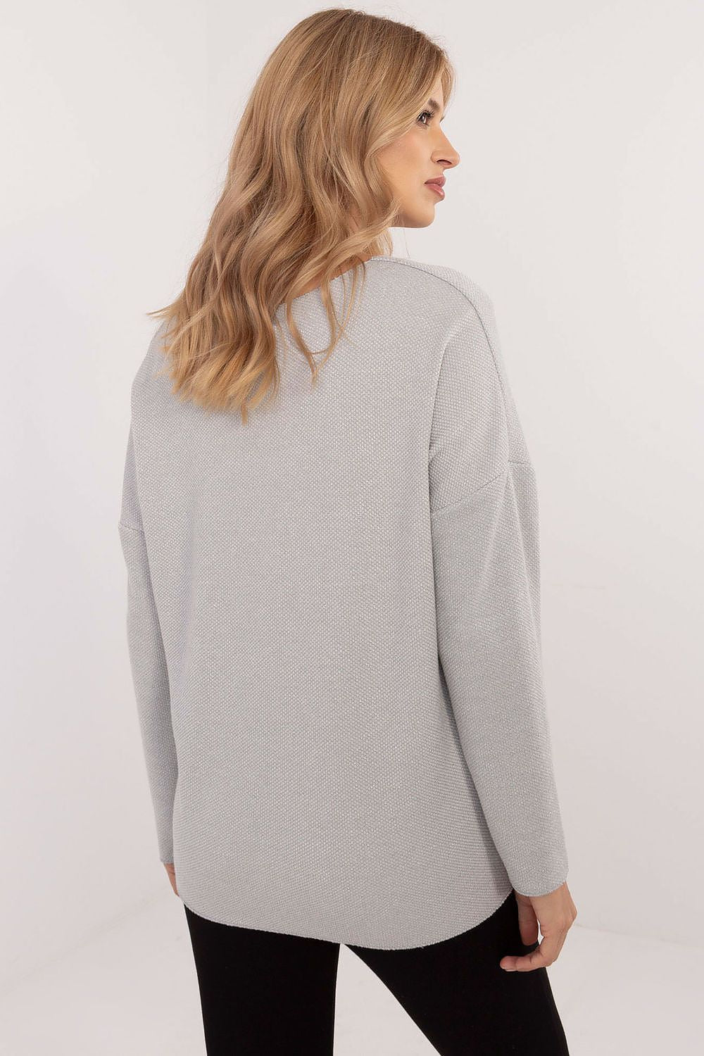 Rear view of Italy Moda's elegant women's V-neck sweater, illustrating its modern cut and subtle textured pattern that enhances feminine appeal.