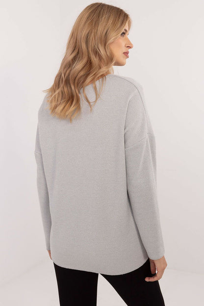 Rear view of Italy Moda's elegant women's V-neck sweater, illustrating its modern cut and subtle textured pattern that enhances feminine appeal.
