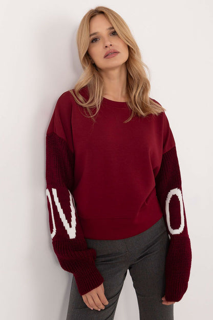 Italy Moda women's sweatshirt featuring a comfortable round neckline and stylish decorative inscriptions, perfect for casual outings.