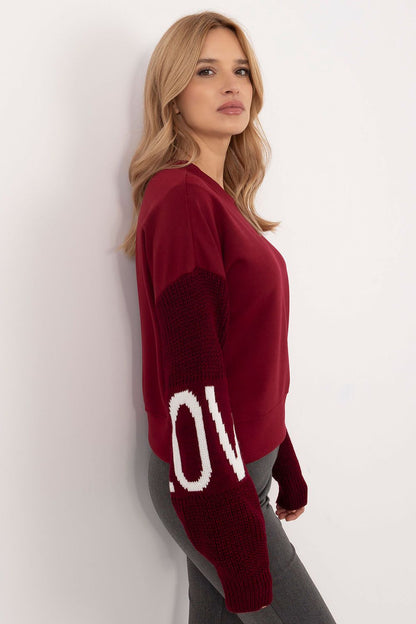 Elegant women's sweatshirt by Italy Moda, designed with long sleeves and a smooth pattern for a contemporary look.