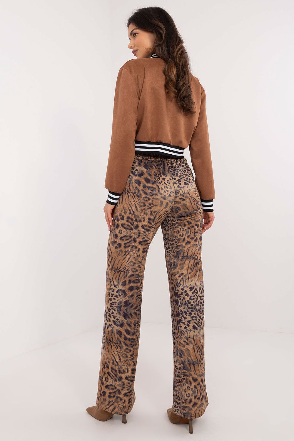 Styled ensemble with elegant high waist trousers with animal motif by Lakerta, designed to elevate casual wear for the modern woman in sizes EU 36-42.