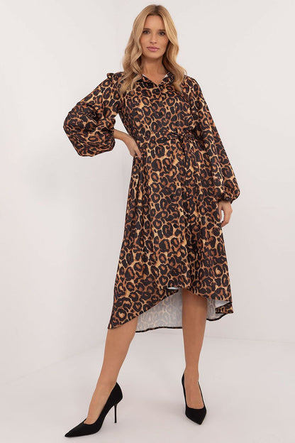 Luxurious midi length asymmetrical shirt dress in animal print by Lakerta, featuring a classic collar, long sleeves, and a stylish belt to accentuate the waist. Perfect for elegant everyday wear, showcasing a blend of comfort and fashion.