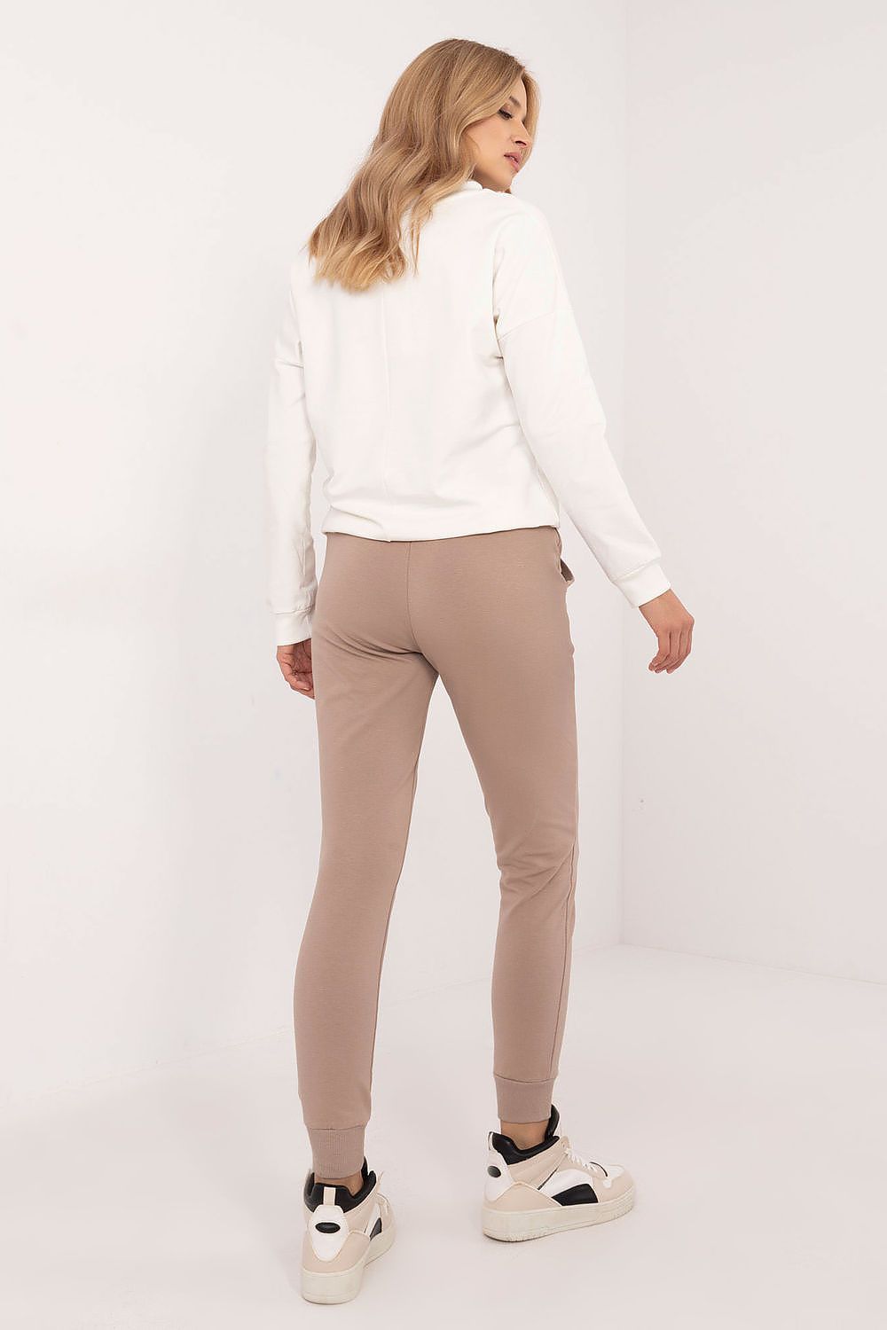 Elegant Cotton Blend Women’s Set by Relevance, consisting of a fashionable sweatshirt with long sleeves and sporty high-waist pants with pockets.