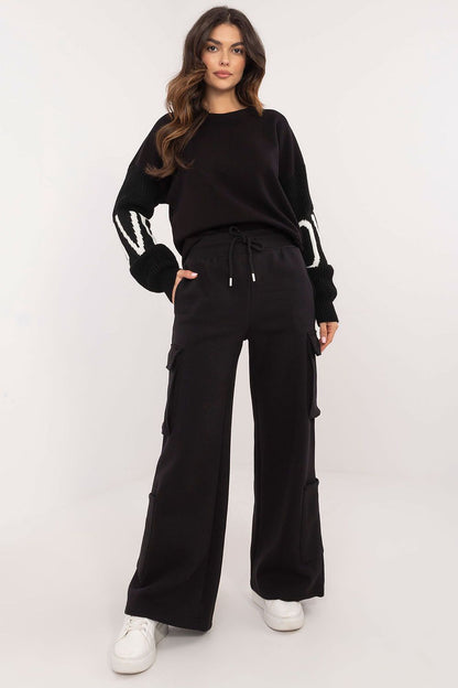 Close-up of Sublevel's Luxury Casual Cargo Sweatpants, highlighting practical pockets and the tie waist for an elegant fit.