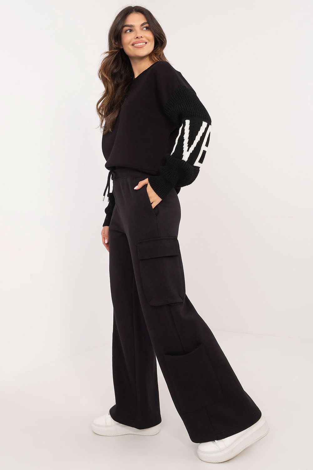 Model wearing Sublevel Luxury Casual Cargo Sweatpants, showcasing the relaxed wide leg and chic casual style.