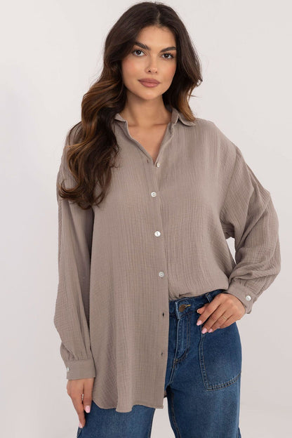 Elegant long sleeve casual shirt in organic cotton by Sublevel, featuring a unique textured fabric, classic collar, and delicate buff sleeves for a sophisticated and stylish look.