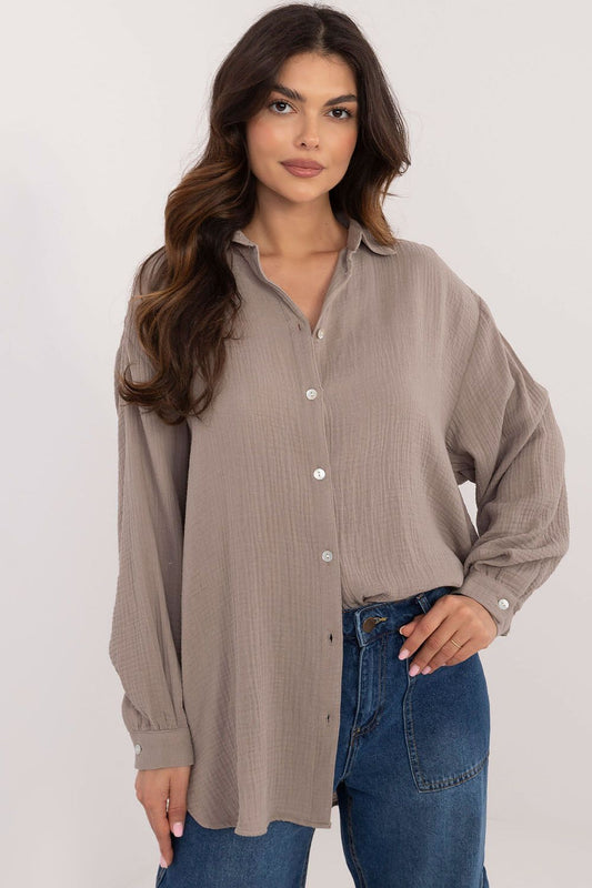 Elegant long sleeve casual shirt in organic cotton by Sublevel, featuring a unique textured fabric, classic collar, and delicate buff sleeves for a sophisticated and stylish look.
