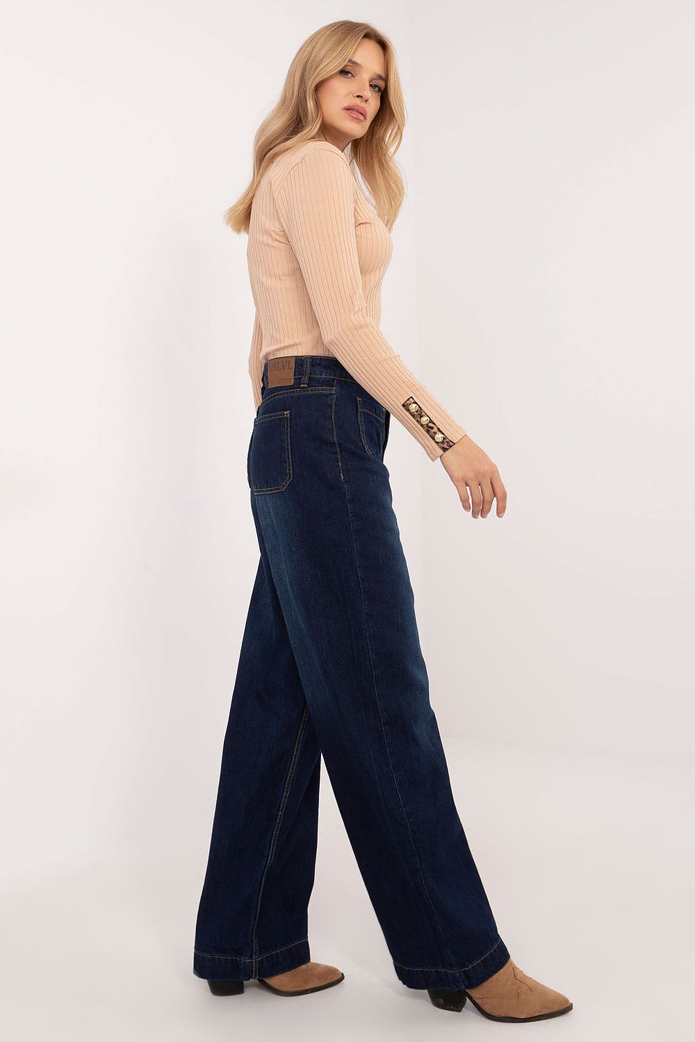 Casual yet luxurious wide-leg denim pants by Sublevel, showcasing the high waistline and tailored fit for an elegant look.
