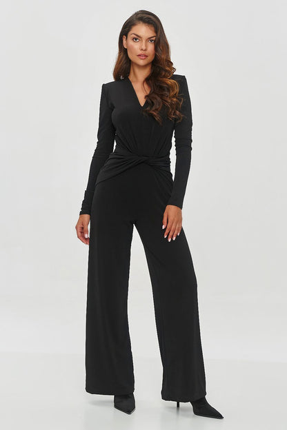 Elegant black jumpsuit by Makadamia featuring a chic V-neck, stylish shoulder pads, a twisted knot waist, and wide-leg design. Available in sizes EU 36 to 42, perfect for formal and casual occasions.