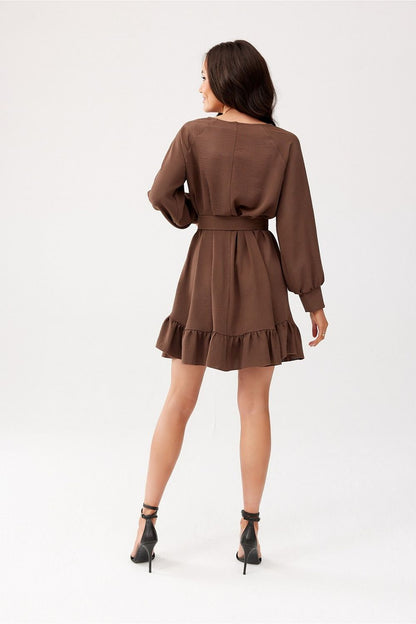 Close-up of the ruffled hem and long sleeves of the Sintra dress by Roco Fashion, showcasing the exquisite craftsmanship.