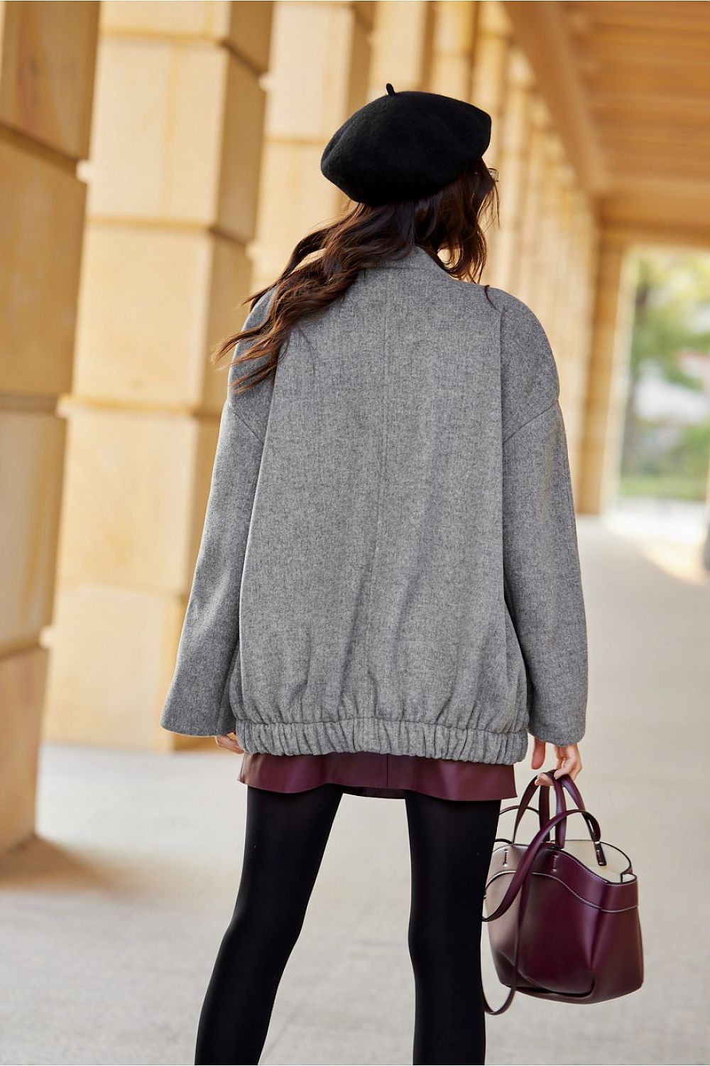 Sophisticated view of the Roco Fashion Clea Jacket showcasing its relaxed design and delicate gathering at the bottom.