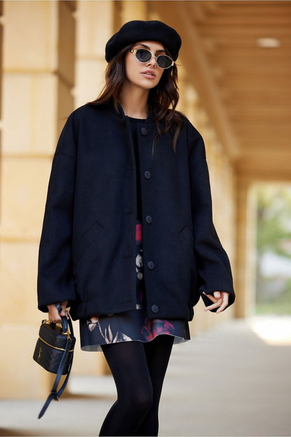 Close-up of the unique stitching details on the Roco Fashion Clea Jacket, enhancing its elegant minimalist design.