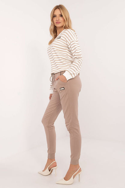 Chic women's tracksuit set from Relevance, showcasing a soft cotton blend fabric, a fashionable V-neck design, and tailored high waist pants ideal for comfort and style.