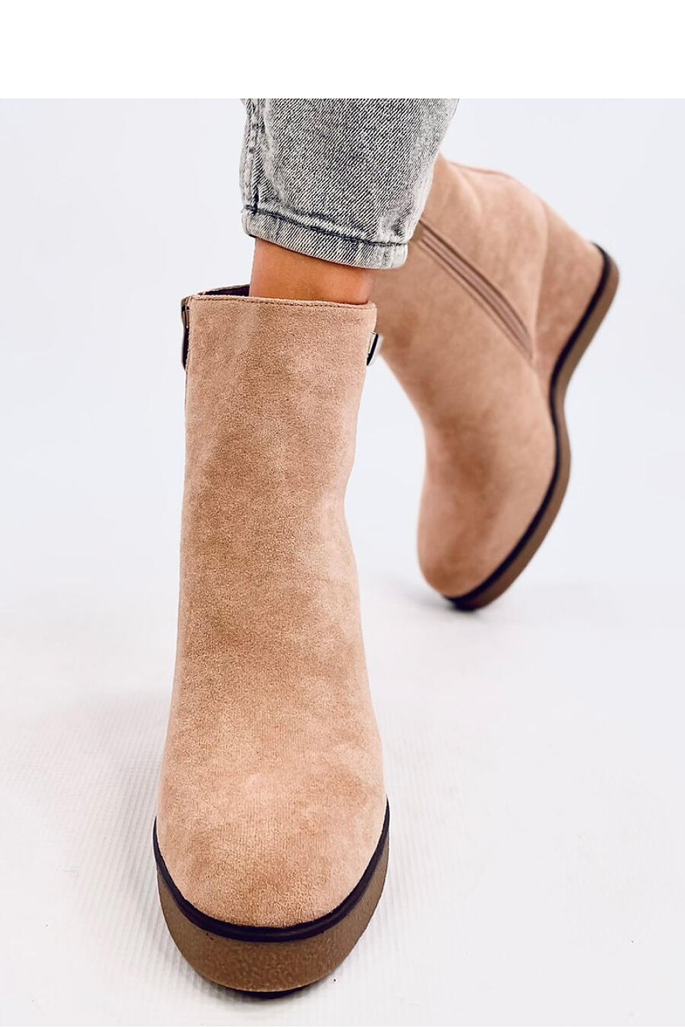 Close-up of Inello's luxurious women's buskin boots adorned with sparkling zircons, showcasing the eco-suede material and cozy fur lining.