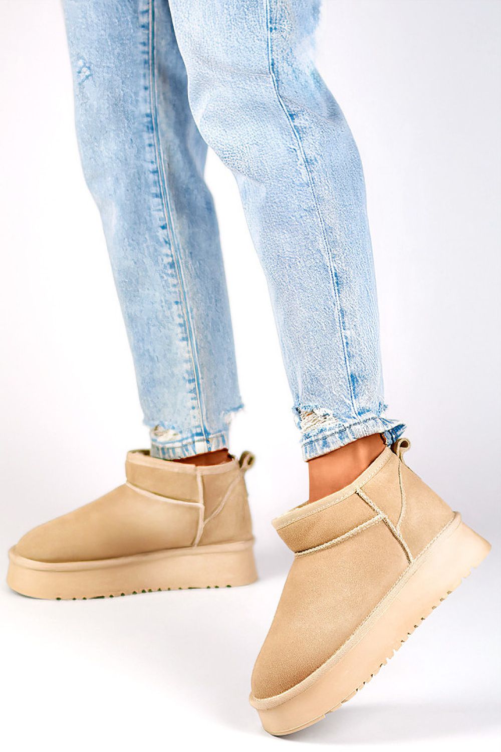 Elegant black women's natural leather snow boots by PRIMO featuring eco-fur lining, 10 cm high upper for warmth, and a fashionable minimalist design.