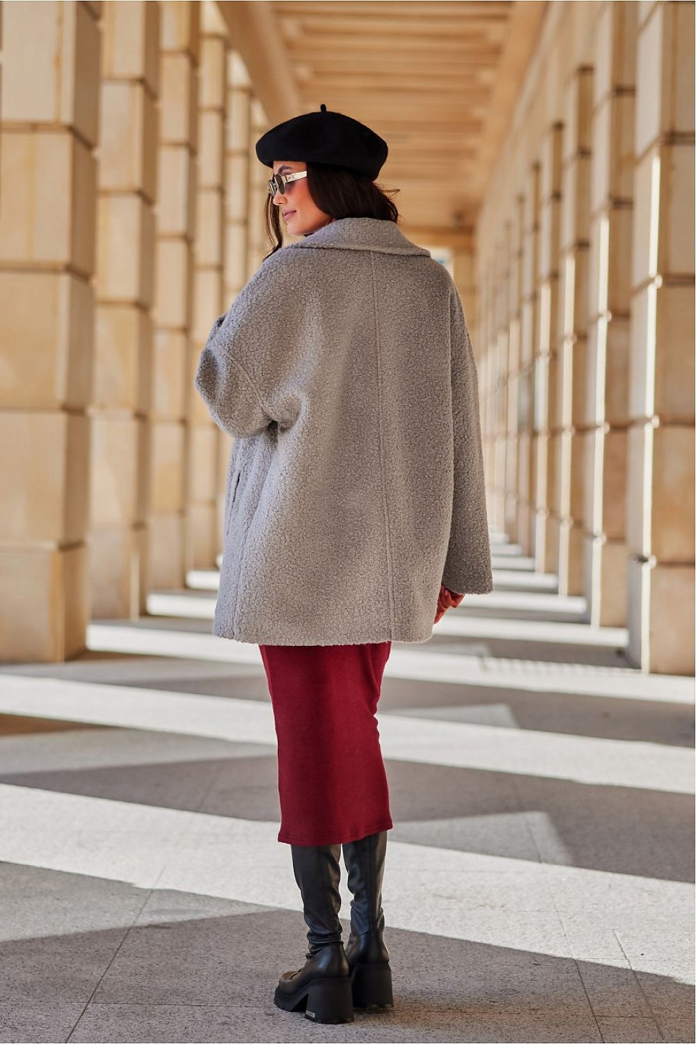 Detailed side view of the Camila Quilted Jacket by Roco Fashion, highlighting the functional pockets and tailored silhouette that flatters a woman's figure.