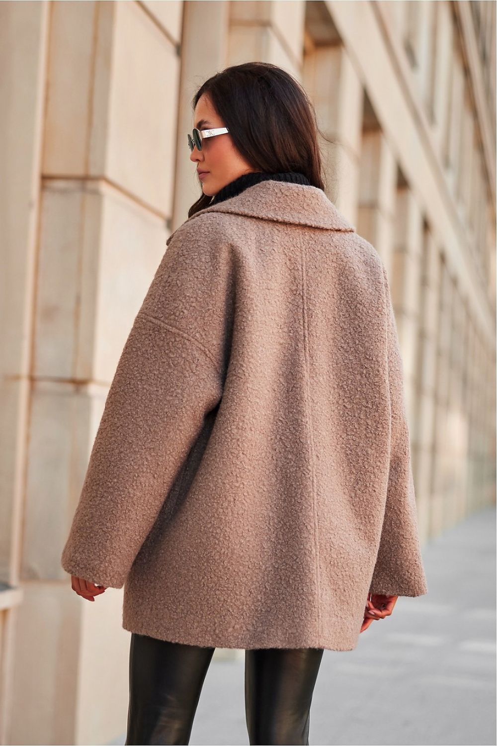 Close-up of the luxurious Camila Quilted Jacket by Roco Fashion, featuring a classic collar, unique cut, and functional side pockets for a blend of fashion and practicality.
