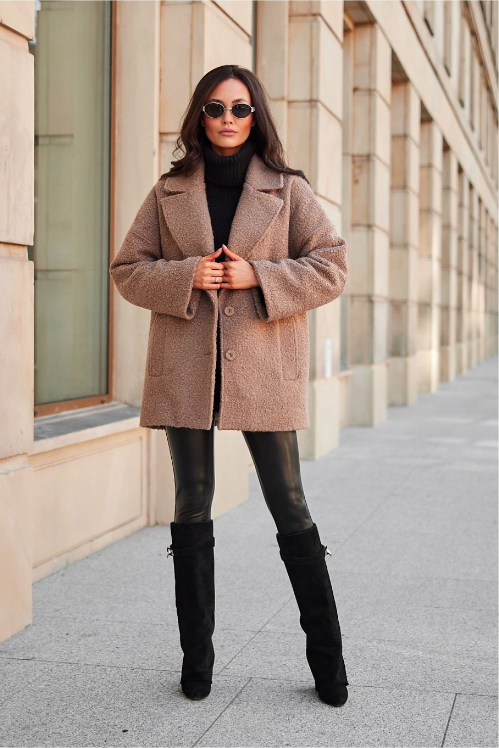 Model wearing the Camila Quilted Jacket by Roco Fashion, elegantly styled with a large shopper bag and long suede boots, epitomising chic winter fashion.