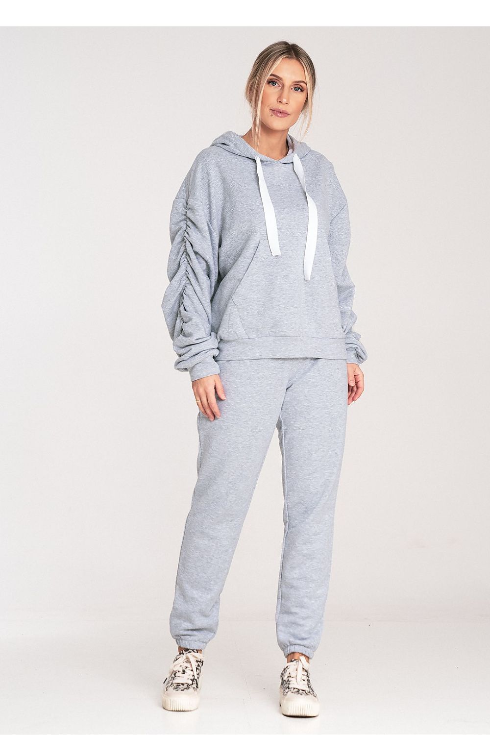 Figl cotton sweatpants in a fashionable setting, emphasizing their versatility for chic casual wear.
