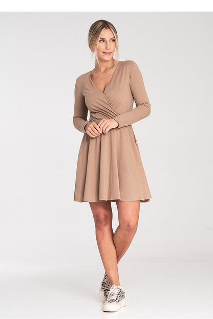 Luxurious Figl dress featuring an elastic waist design and envelope neckline, combining comfort and style.
