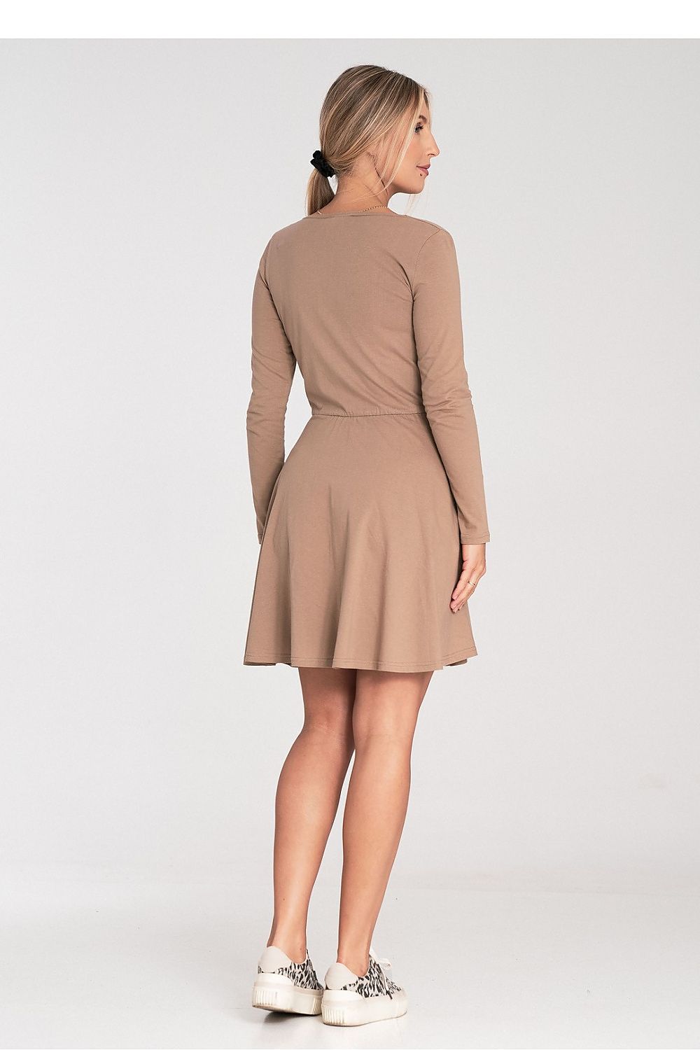 Fashionable Figl long-sleeved cotton dress, designed for sophistication with its graceful flared hem and classic neckline.
