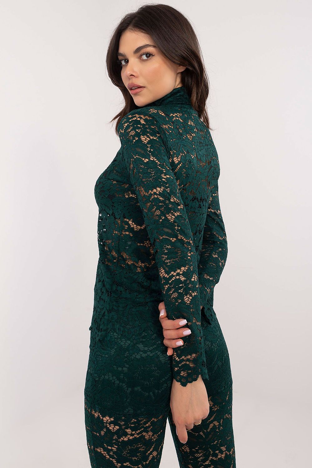 Model wearing the elegant lace blouse with turtleneck by Italy Moda, ideal for sophisticated occasions.