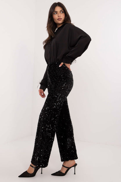 Italy Moda elegant sequin trousers displayed on a hanger, highlighting their exquisite texture and minimalist design for a refined look.