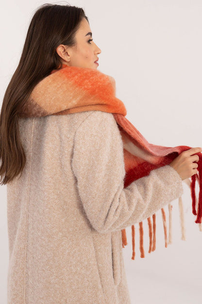 AT stylish polyester scarf with classic check pattern, displayed on a model, demonstrating versatility in winter fashion.