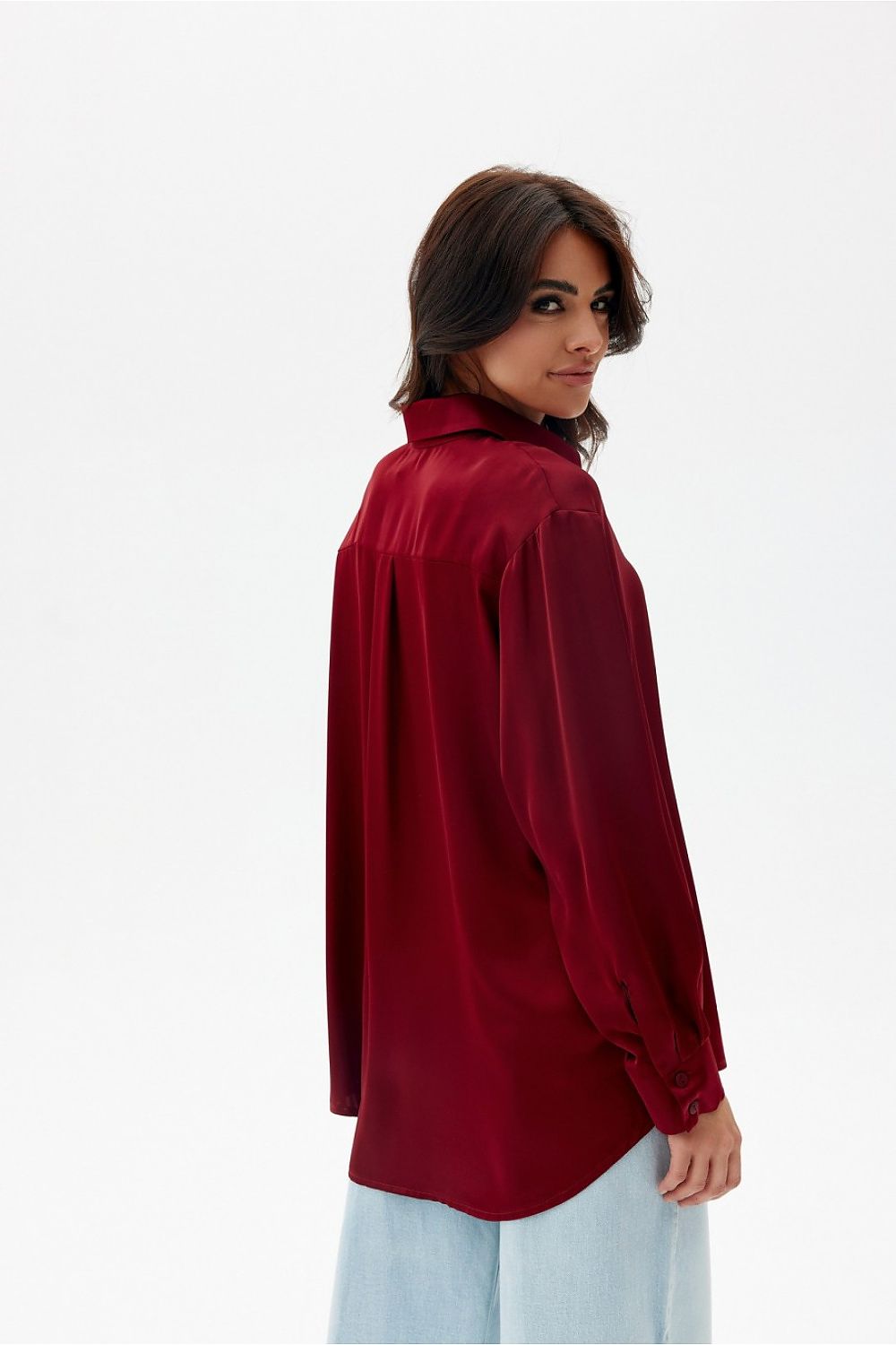 Stylish model wearing oversized long sleeve satin shirt by Roco Fashion, exemplifying chic comfort for casual and formal occasions.