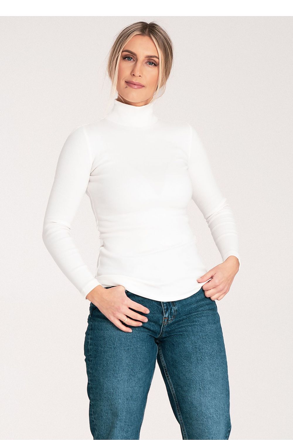 Close-up of Figl luxury cotton turtleneck, highlighting the soft ribbed fabric and elegant silhouette.