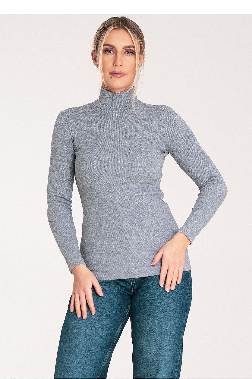Model showcasing Figl luxury cotton turtleneck with long sleeves, styled for a sophisticated look.
