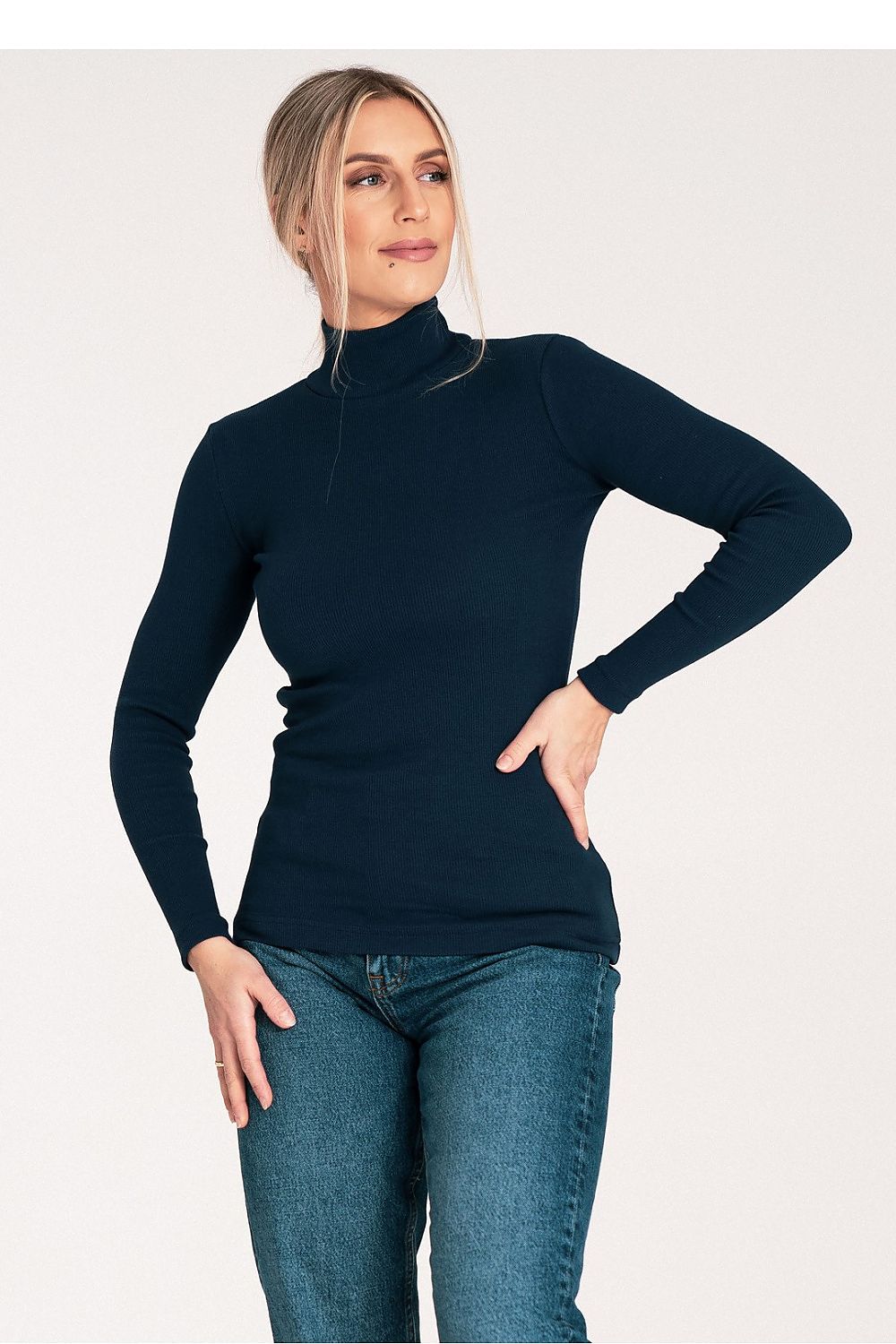 Stylish Figl cotton turtleneck with a modern silhouette, worn by a model showcasing its luxury appeal.