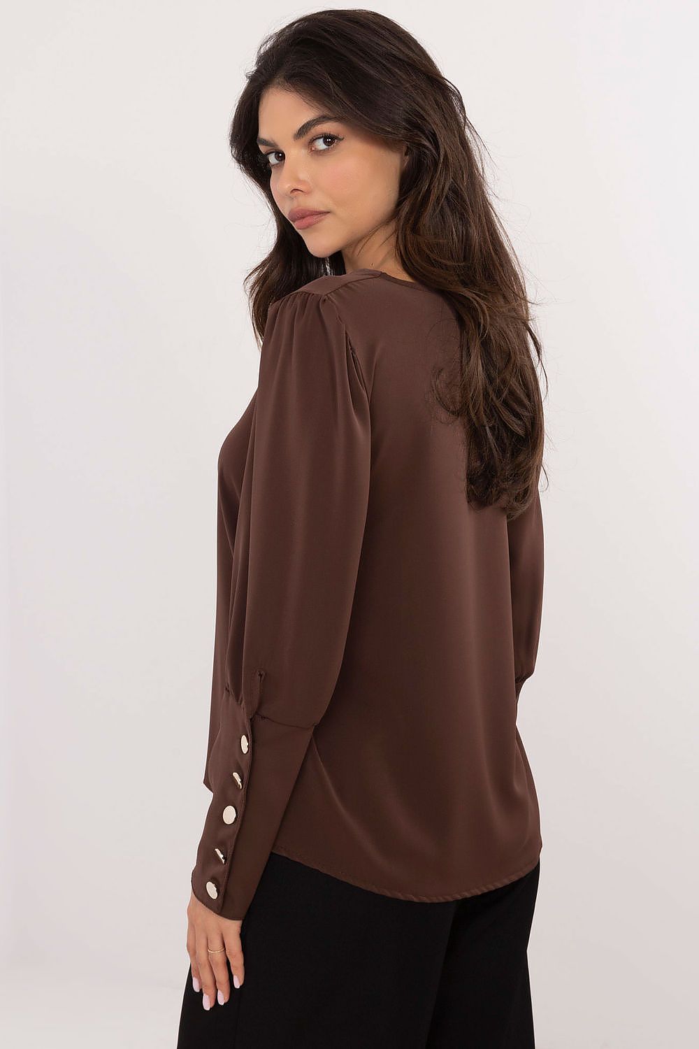 Italy Moda's Elegant V-Neck Blouse draped on a mannequin, highlighting its classic silhouette and chic puffy sleeves.