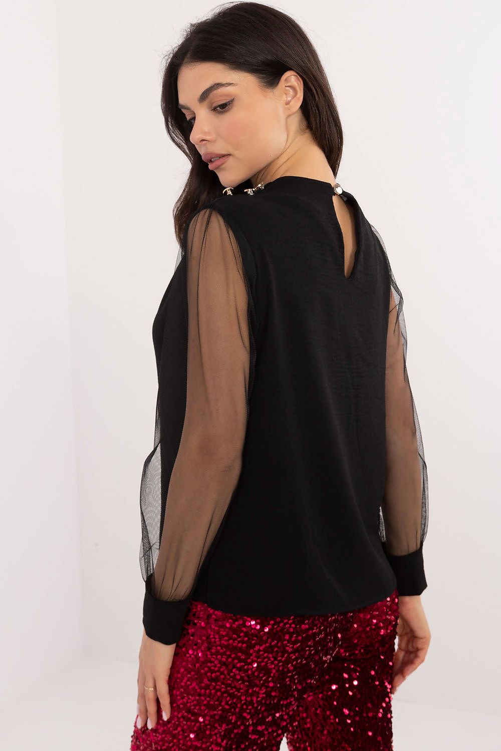Stylish Italy Moda blouse displayed with a round neckline and unique puffy sleeves, suitable for sophisticated occasions.