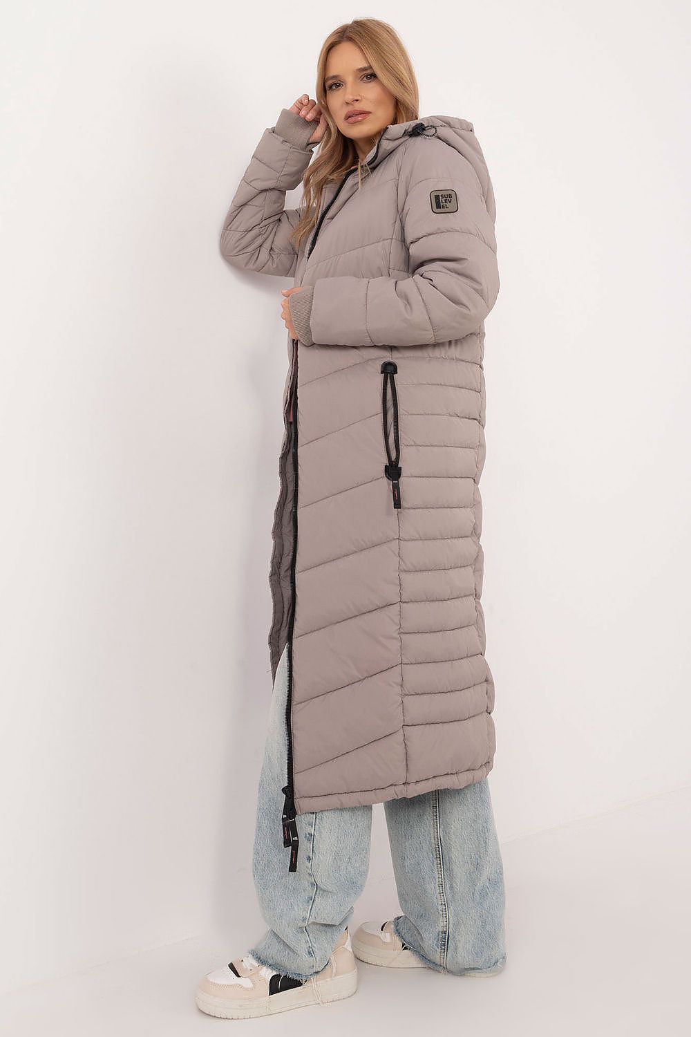 Luxurious Sublevel women's coat featuring a smooth design and double-slider zipper for easy wear, perfect for chilly autumn and winter days.