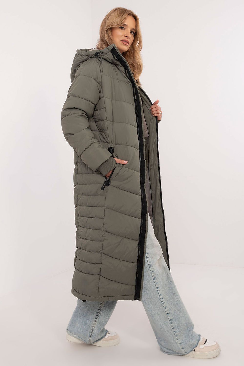 Elegant long women's coat by Sublevel, crafted from high-quality polyester, featuring thumb hole cuffs for comfort and practicality.