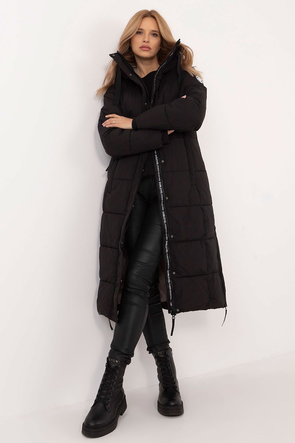 Stylish long women's coat by Sublevel, featuring an elegant casual design with a hood and exquisite embroidery, ideal for autumn and winter wear.