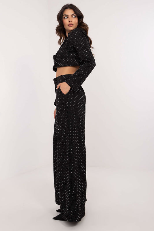 Close-up detail of Italy Moda's sequined palazzo pants, highlighting exquisite craftsmanship and stylish silhouette suitable for upscale occasions.